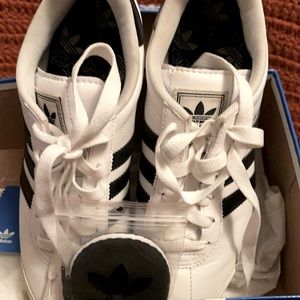 White with black stripes Adidas Samoa’s
